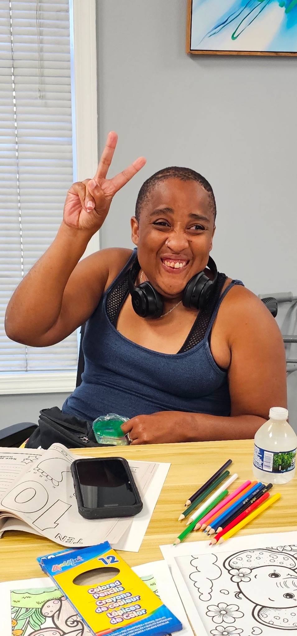 Marci participating in an activity at the Illuminate Care center